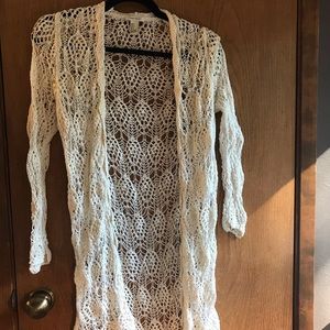 Woven styled cardigan.
